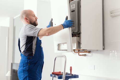 What are the necessary steps to install a new water heater thermostat